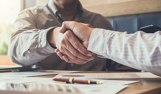 Greeting new colleagues team, business people shaking hands during a meeting to sign agreement and become a business partner, Successful businessman handshake after good deal for both companies.